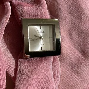 Stylish scarf Quartz watch. Silver face, hands and buckle. New. Never worn.